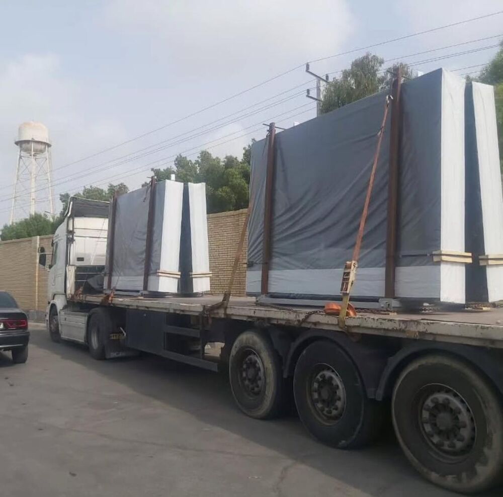 Flatbed truck loaded with crated glass for export