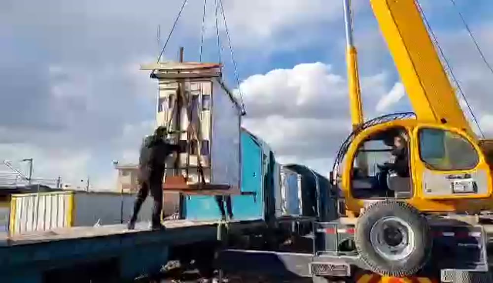 Crane loading finished product for transport